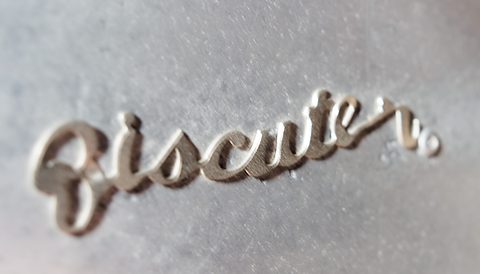Chrome handwritten Biscuter script on a dull silver aluminium bonnet. Opens a larger view