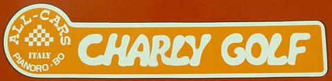 Orange decal with a white chequered roundel reading All-Cars Italy Pianoro-BO beside the words Charly Golf in white. Opens a larger view