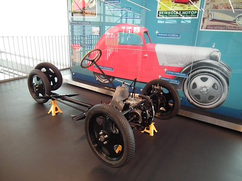 Chassis from the side and above: DKW single-cylinder engine at the front, steering column and a long backbone tube. Opens a larger view
