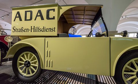 Side view of a cream car with a box body lettered ADAC Straßen-Hilfsdienst and pale spoked wheels. Opens a larger view