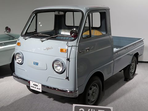 Pale blue small cab-over pick-up with round headlamps and a ‘Hijet’ script on its nose.