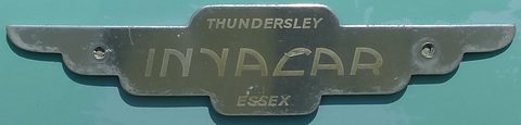 Chrome winged badge reading Thundersley Invacar Essex on turquoise paint. Opens a larger view