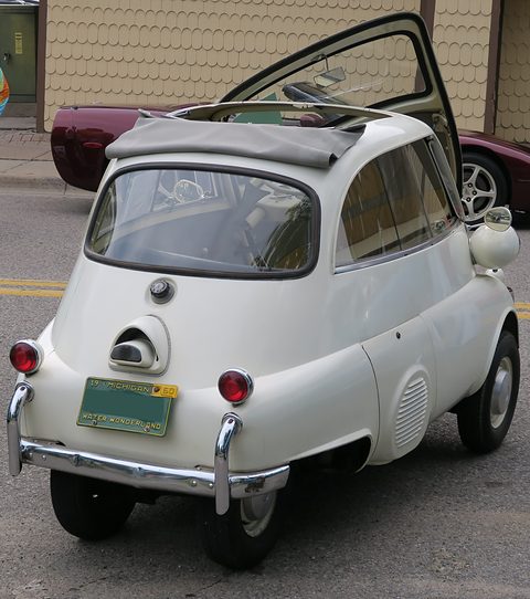 Ivory bubble car with its door open seen from behind, a Pennsylvania-style plate on the back. Opens a larger view