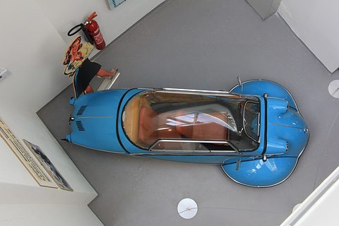 Top view of a blue cabin scooter with a clear canopy over two seats in line. Opens a larger view