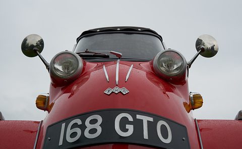Red nose with two headlamps, mirrors, an FMR badge and registration 168 GTO under a grey sky. Opens a larger view
