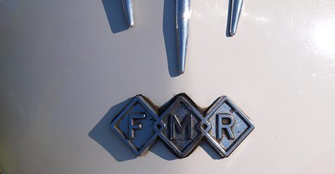 Three blue diamond shapes with the letters F, M and R on white paintwork. Opens a larger view