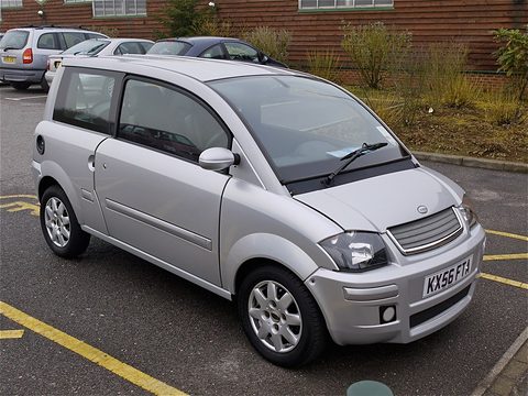 Silver small hatchback with a slatted nose parked in a bay with yellow lines. Opens a larger view