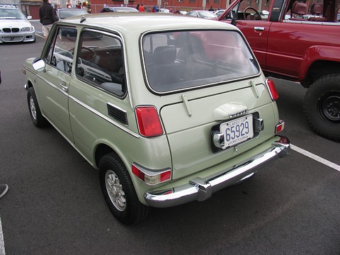 Rear three-quarter of a pale green small saloon with a Pennsylvania classic plate. Opens a larger view