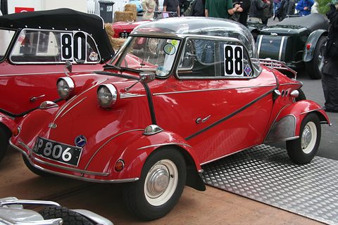 Red bubble car with its canopy shut and a large 88 on the side window, on a chequer-plate floor. Opens a larger view
